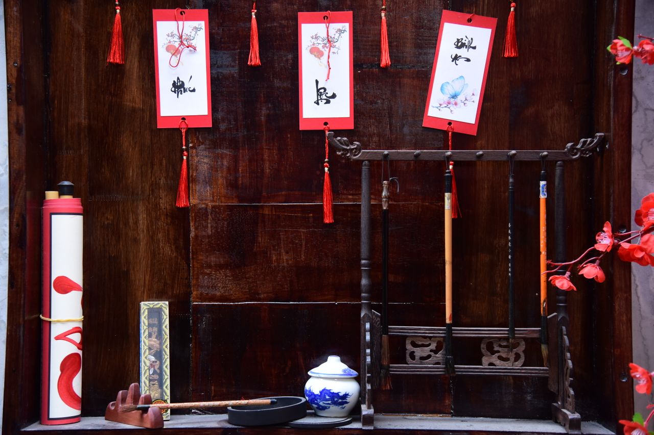 Intricate setup of Chinese calligraphy tools and decorative elements, showcasing artistic tradition.